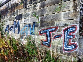 Graffiti on the inner face of the southern boundary wall of the graving docks.