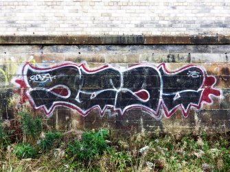 Graffiti on the inner face of the southern boundary wall of the graving docks.
