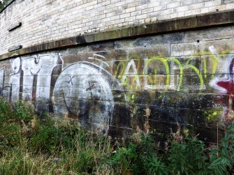 Graffiti on the inner face of the southern boundary wall of the graving docks.