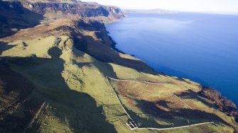 Oblique aerial view showing township and later sheep fank at Hallaig.