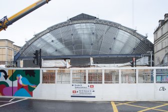 View of exposed tain shed during building work, from south