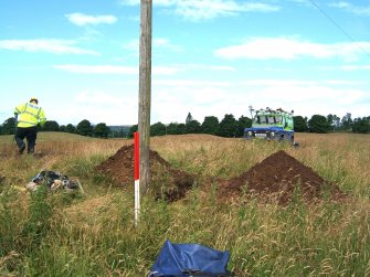 Photograph from watching brief at overhead power line, pole trench and surrounding area, viewed from the E, at Ardoch Roman Fort Braco, Perthshire