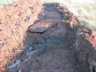 Archaeological evaluation, Trench 10 showing concrete from W, Olympic Rings, Dundonald, Ayrshire