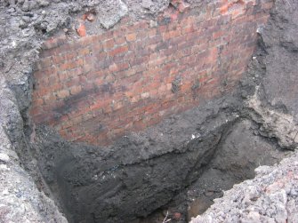 Archaeological evaluation, Trench 1, General view of brick foundation wall from NE, 4-5 West Park Place, Edinburgh