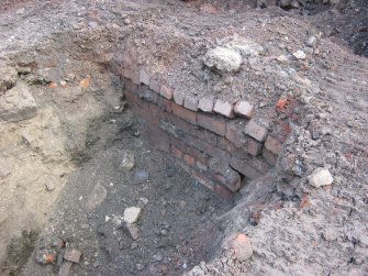 Archaeological evaluation, Trench 2, General view of brick foundation wall from SW, 4-5 West Park Place, Edinburgh