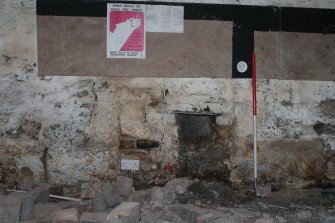 Historic building recording, Basement, Room -1/4, Detail of the blocked fireplace in S wall from N, Former United Presbyterian Church, 17-21 Blackfriars Street, Edinburgh