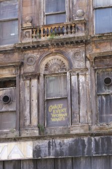 Detail of central window on second floor of 335- 345 Argyle Street.  