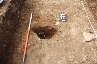 Archaeological Evaluation photograph, Lower Gauls Barrow, Context 0104, half-sectioned