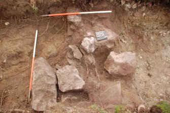 Archaeological Evaluation photograph, Lower Gauls Barrow, Retaining wall 0204