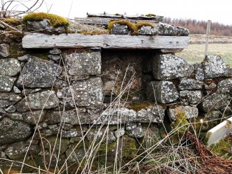 View from inside the wash-house of the blocked window in the NW wall.