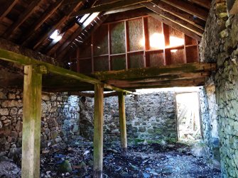 A view from the NE end of the stable looking SW across the interior.