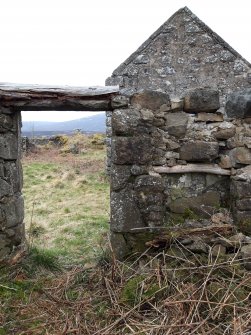 View from NE of the SW end of the compartment at the SW end of the farmhouse, with the gable of the stable in the background.