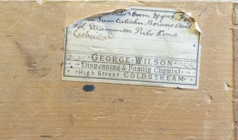 Coldstream, 61 High Street. Interior. Pharmacists medicine drawer. Detail showing drawer label on back of drawer for 'George Wilson', former chemist.