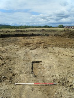 Archaeological excavation, Pit [006] mid-excavation shot from W, Darnley Mains