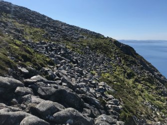 Eigg, An Sgurr, fort. Looking along the southern part of the fort wall, facing S. 