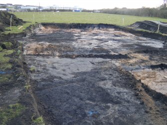 Watching brief, View of main track topsoil strip from NE, M8 enabling works, Coatbridge
