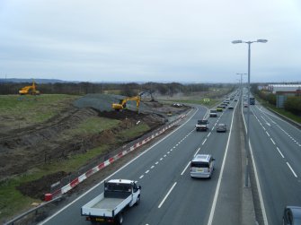 Watching brief, View of works to the W side of the junction from SW, M8 enabling works, Coatbridge