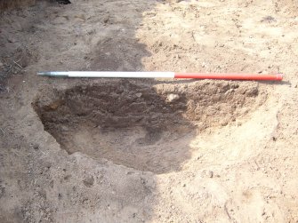 Archaeological evaluation, Trench 12, E facing section of posthole [3] (4) from W, Seton Sands, East Lothian