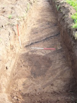 Archaeological evaluation, Trench 13, view to NE showing unexcavated pit [1] (2) and linear features (pit cutting linear) from NE, Seton Sands, East Lothian