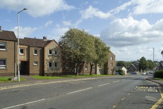 General view from north-west showing Moodie Street elevation of Nos 22-38 Kirklands, Dunfermline