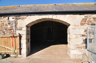 Historic building survey, N-Range, S-facing elevation, segmented arched doorway with rebuilt quoins, Crunklaw Steading, near Duns, Scottish Borders