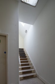 View up service stair to 2nd floor.