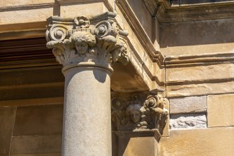 View of carved details on porch columns.