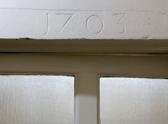 Detail of '1703' datestone in south-east corridor on ground floor, Brechin Castle.