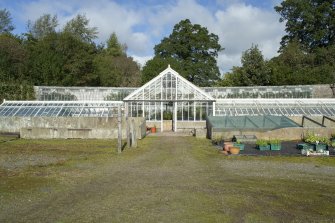 View from south showing glasshouses in garden, Brechin Castle.