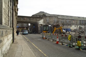 View from west, looking along Foundry Street, showing the partial demolition and rear of Pilmuir Works, Pilmuir Street, Dunfermline.