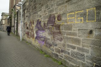 General view from south, showing spray paint tagging on west elevation of former Pilmuir Works, Pilmuir Street, Dunfermline.