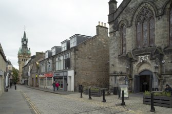 General view from north-east showing west side of Bruce Street (Nos 3-35, including former North Free Church/St John's Church (right)), Dunfermline