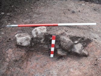 Watching brief, SE-facing section across pit 020, Ground to the rear of 51A/51B High Street, Jedburgh, Scottish Borders