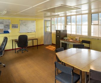 Interior.  Mezzanine/ First floor.  View of office and mess room