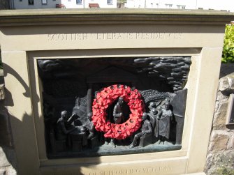 View of sculpture in wall in front of bowling green adjacent to Callander House and Whitefoord House, Canongate, Edinburgh.