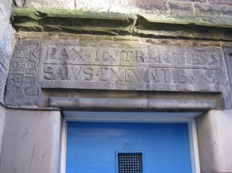 Detail of carved stone lintel above doorway to No 84 Canongate, Nisbet of Dirleton's House, 82-4 Canongate, Edinburgh.