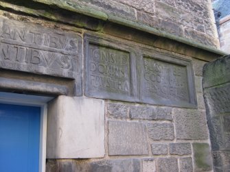 Detail of carved stones beside doorway to No 84 Canongate, Nisbet of Dirleton's House, 82-4 Canongate, Edinburgh.