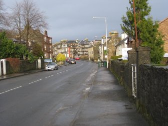 General view from south-east looking along Ardbeg Road towards High Road, Ardbeg, Rothesay, Bute.