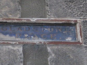 Detail of 'Gladstone Terrace' street sign on Nos 15-19 Castle Street, Port Bannatyne, Bute.