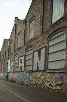 Detail of graffitti wall on southside of Dunnikier Works from east.