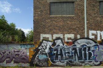 Detail of graffitti wall on southside of Dunnikier Works.