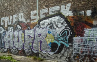 Detail of graffiti wall on southside of Dunnikier Works.