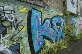 Detail of graffitti wall on southside of Dunnikier Works.