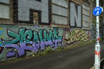 Detail of graffitti wall on southside of Dunnikier Works.