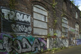 Detail of graffitti wall on southside of Dunnikier Works.