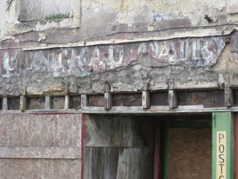 Detail of shop sign on former shop front at Nos 9-13 Watergate, Rothesay, Bute.