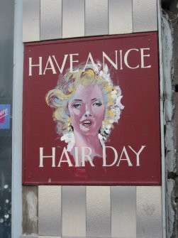 Detail of sign at 'Maison Gina' hairdressers' salon, Nos 11-13 Montague Street, Rothesay, Bute.