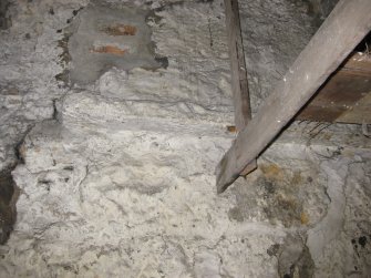 Interior view showing detail of remains of timber-framed cupboard/shelving and wall in 21 Queen Anne Street, Dunfermline.