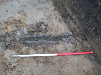 Archaeological evaluation, Trench 14 Field Drain exposed but intact, Site 13, Borders Railway Project