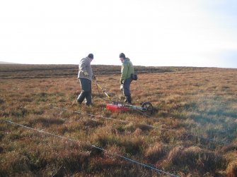 Ground penetrating radar survey, GPR apparatus in use at Oliclate Site B, Loch of Yarrows, Highland